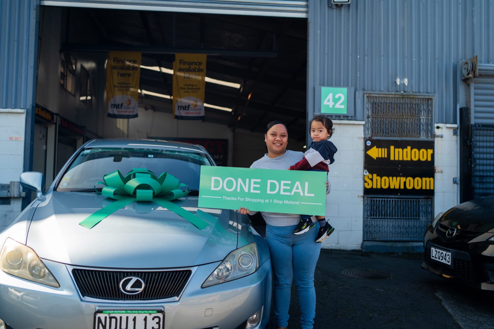 A customer handover at 1 Stop Motors