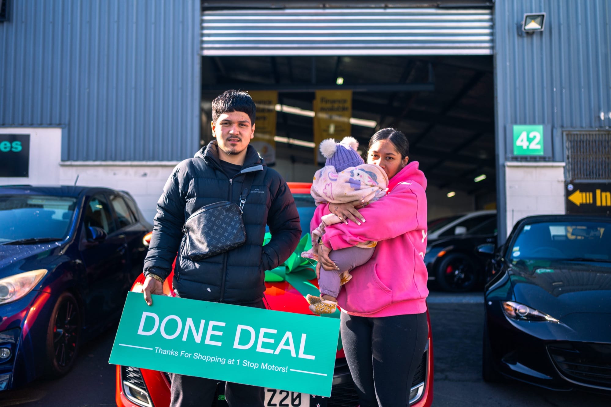 A customer handover at 1 Stop Motors