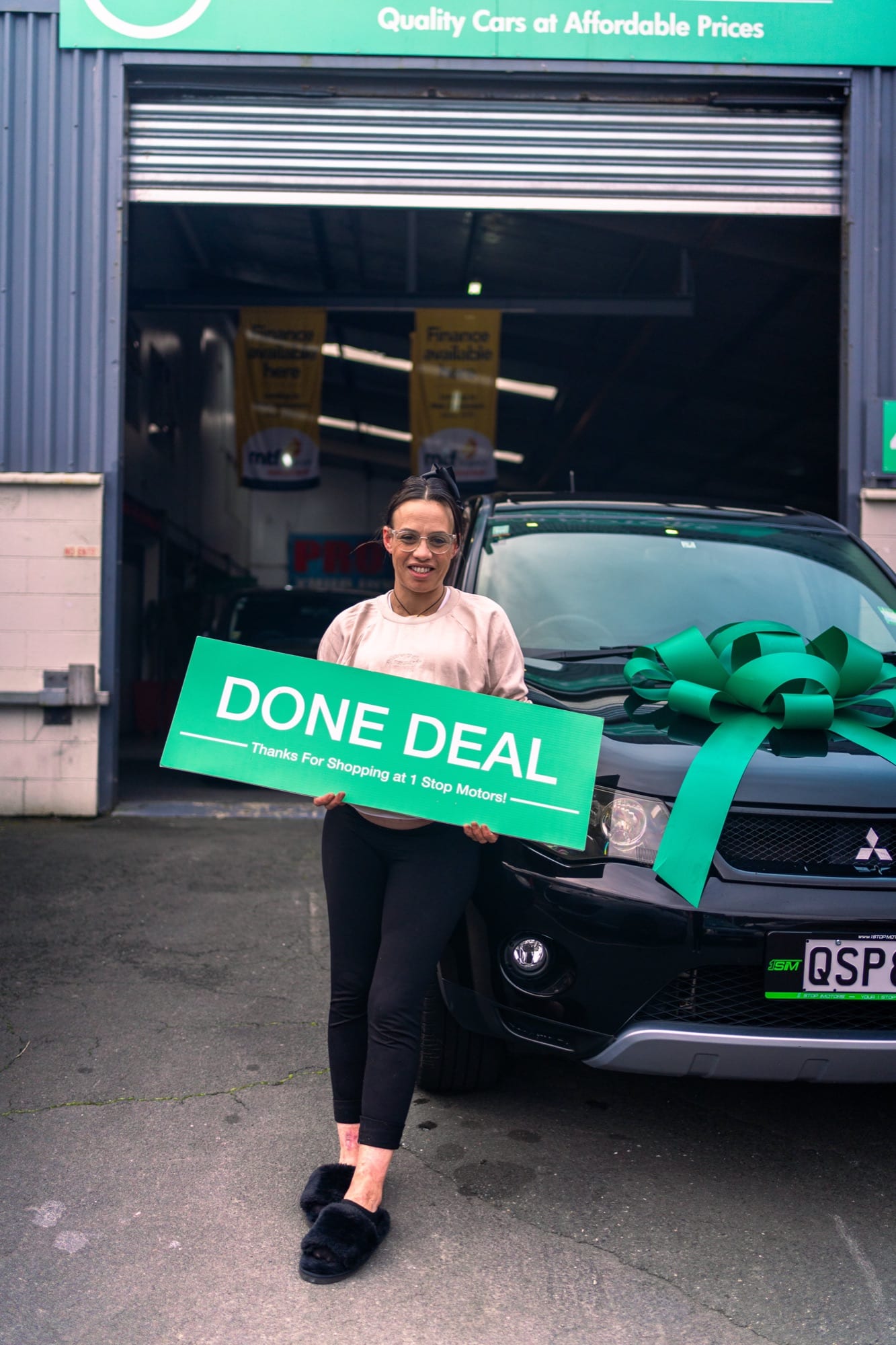 A customer handover at 1 Stop Motors