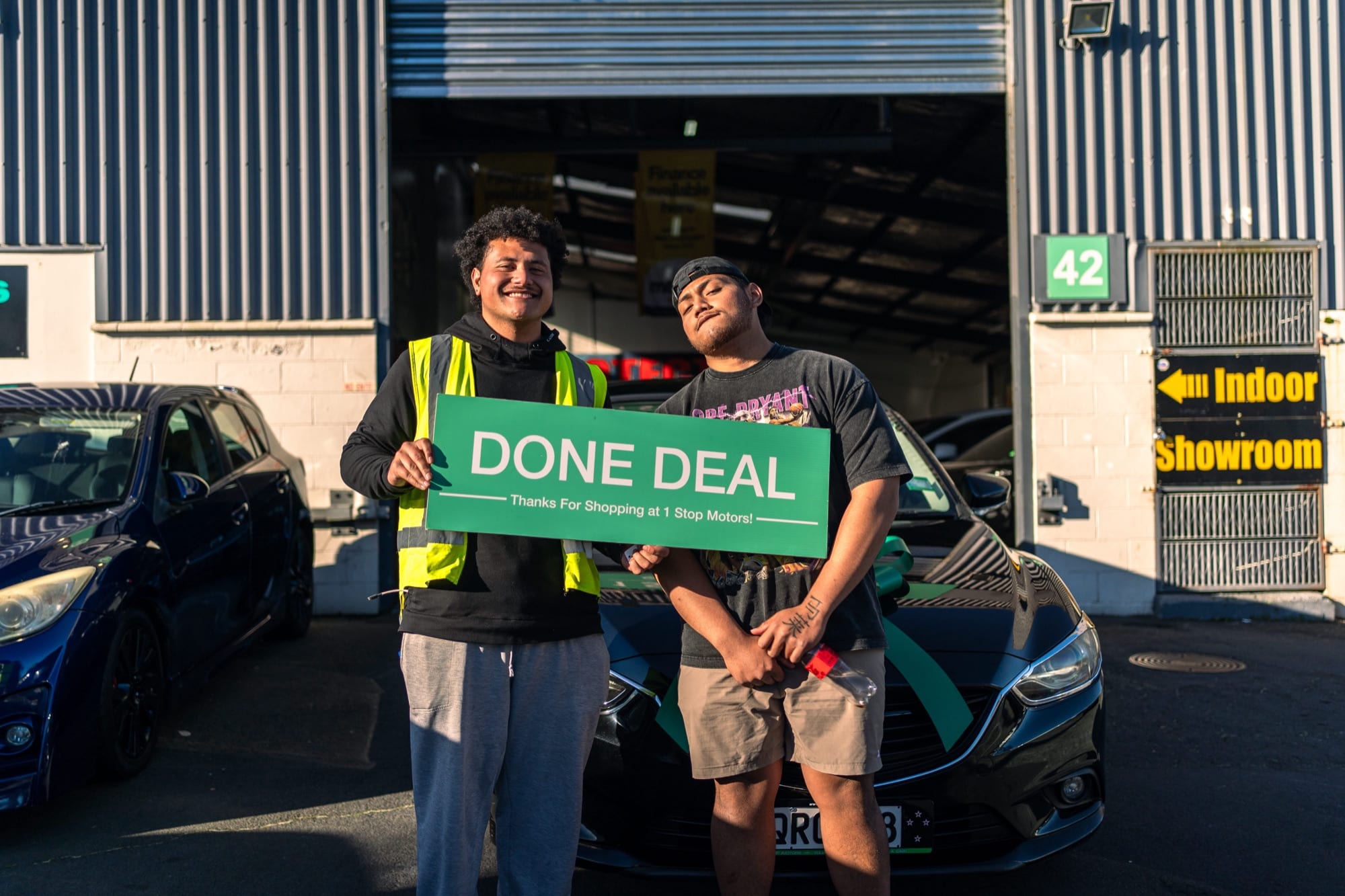 A customer handover at 1 Stop Motors