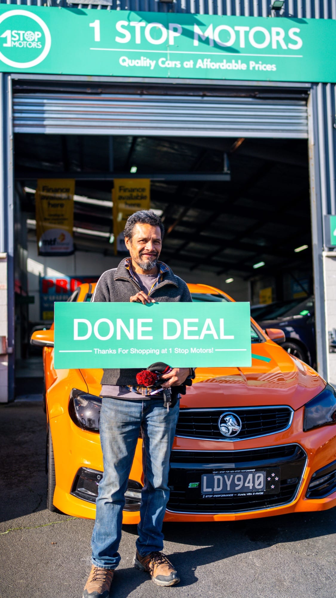 A customer handover at 1 Stop Motors