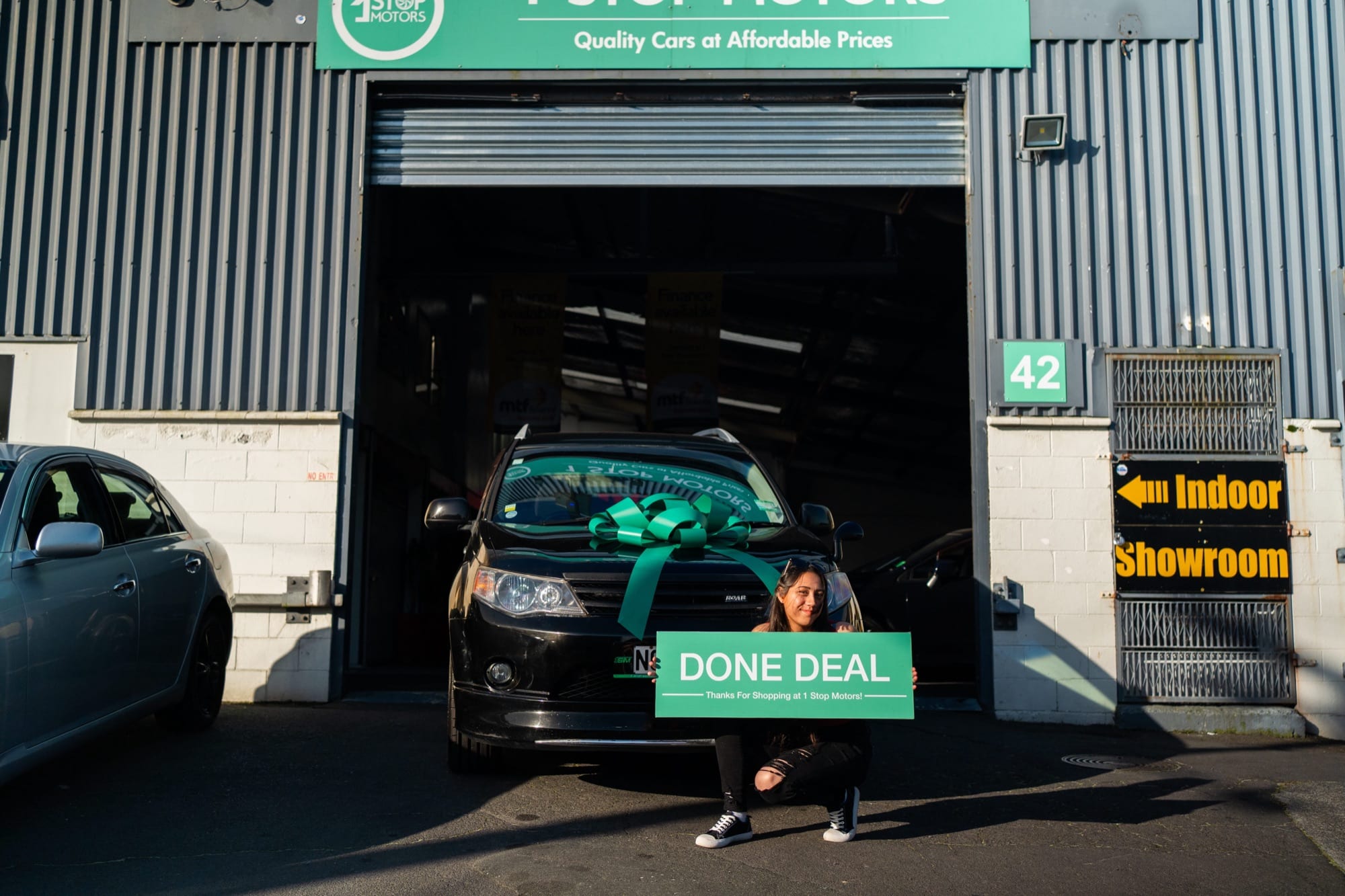 A customer handover at 1 Stop Motors
