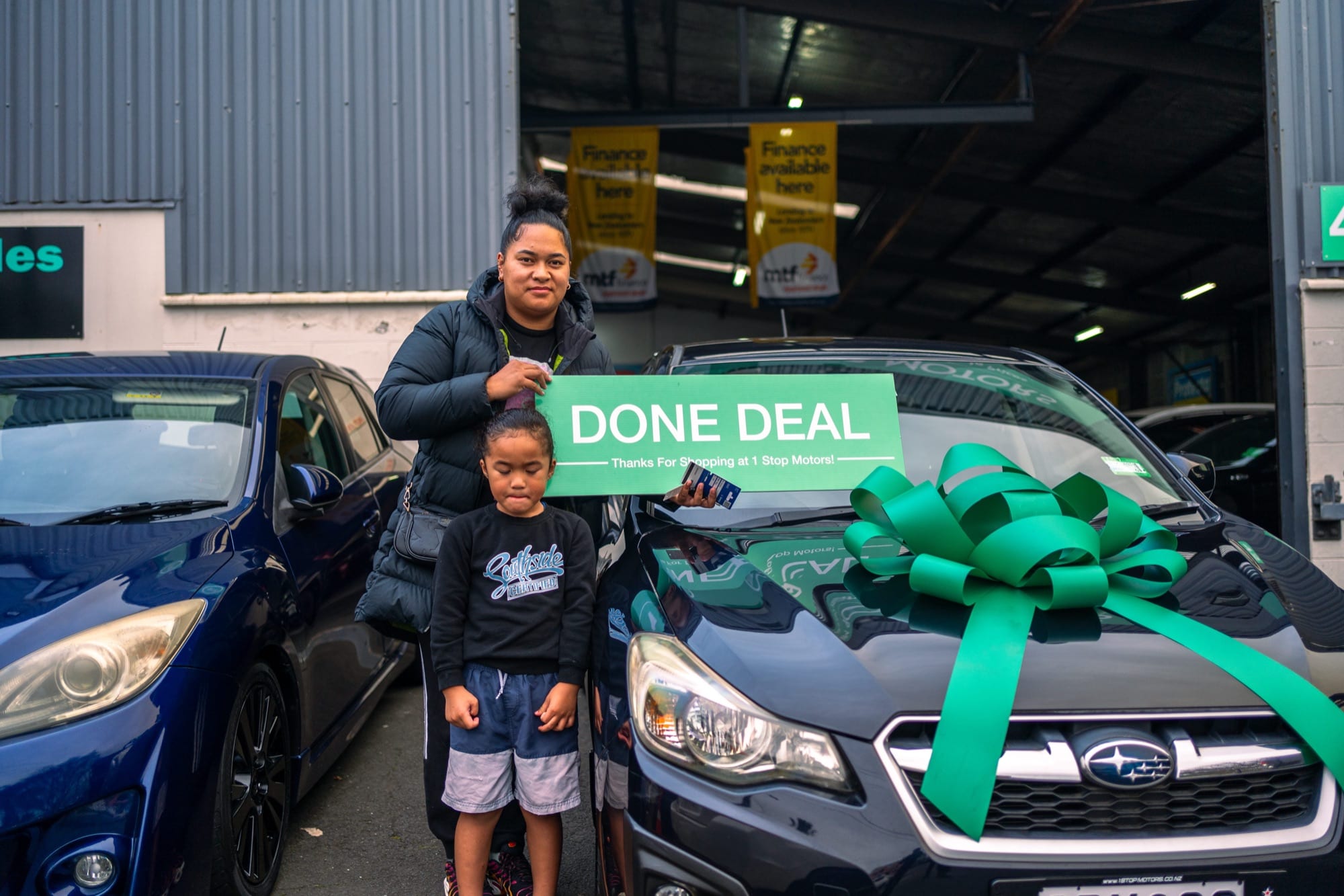 A customer handover at 1 Stop Motors
