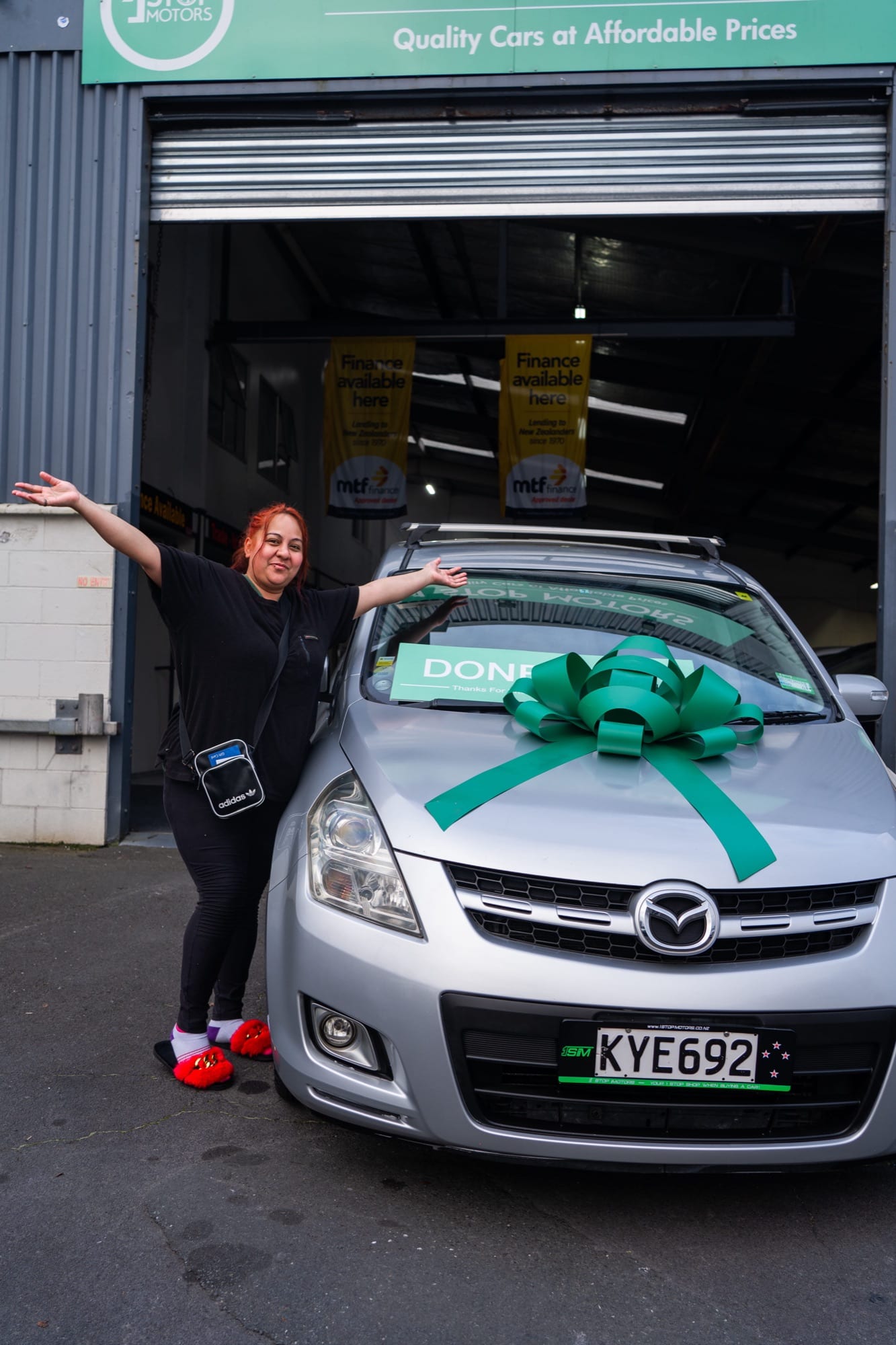 A customer handover at 1 Stop Motors