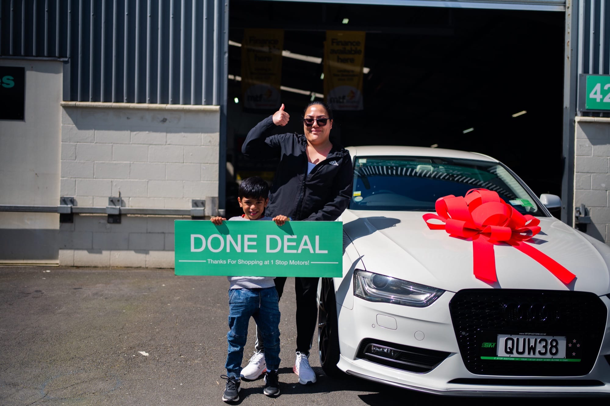 A customer handover at 1 Stop Motors