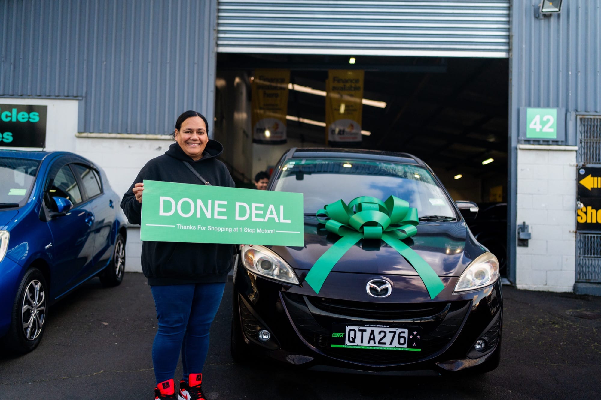 A customer handover at 1 Stop Motors
