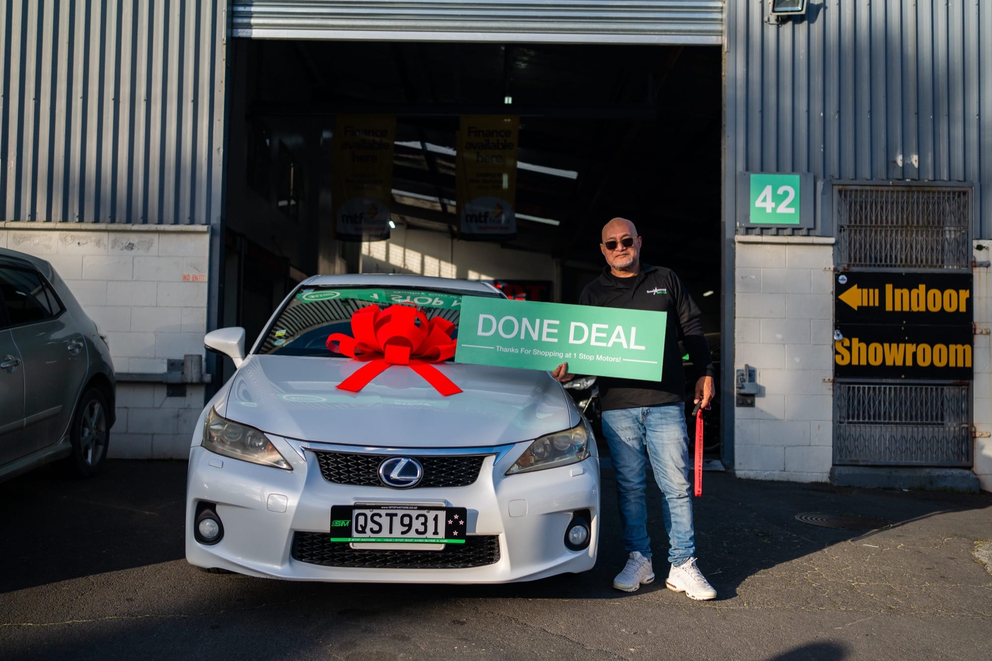 A customer handover at 1 Stop Motors